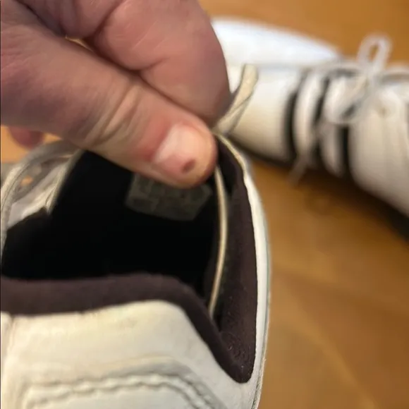 Adidas White and Black Athletic Shoes with Iconic Stripes