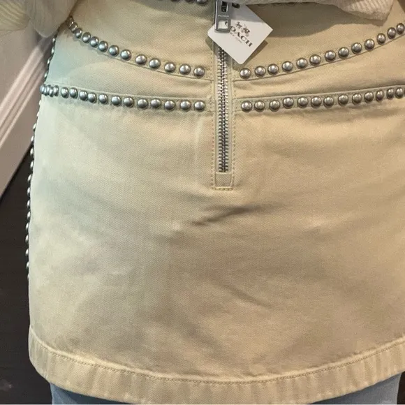 Coach cream miniskirt with silver studs