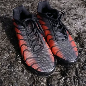 Red and Black Athletic Shoes